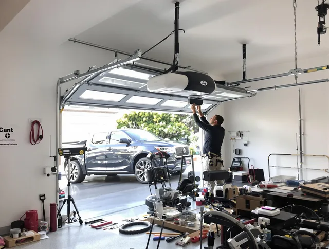 Warrensville Heights Garage Door Repair specialist installing smart garage door opener system in Warrensville Heights home