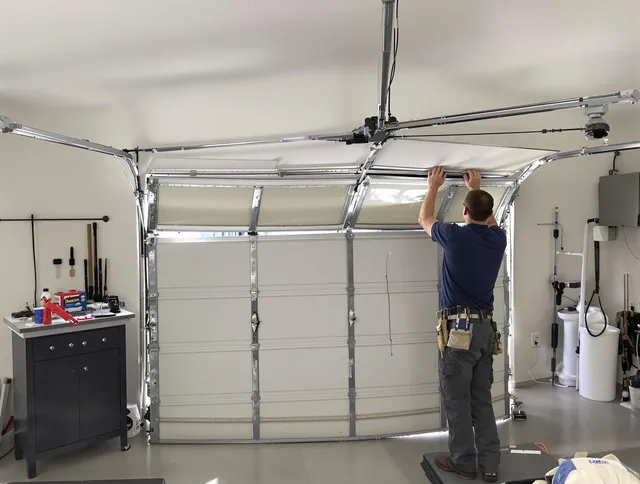 Warrensville Heights Garage Door Repair specialist performing precise section replacement on Warrensville Heights garage door